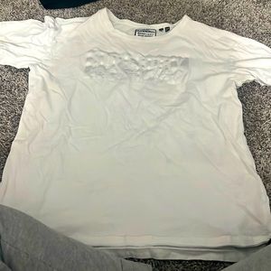 White and silver tee.